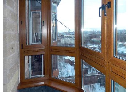 Французское остекление балкона профилем Veka с ламинированием под дерево в Москве
