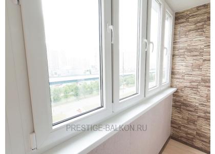 Тёплое остекление балкона профилем КВЕ и комбинированной отделкой пластиком и деревом в Москве