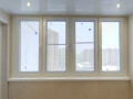 Тёплое остекление балкона профилем КВЕ и отделкой панелями ПВХ в Москве