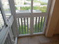 Панорамное остекление балкона и отделка пола плиткой в Москве