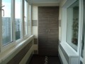 Теплое остекление балкона с утеплением и отделкой ПВХ панелями и ламинатом в Москве